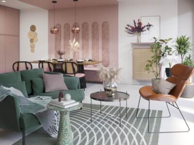 Przytulny salon z zieloną sofą i eleganckim rattanowym fotelem.