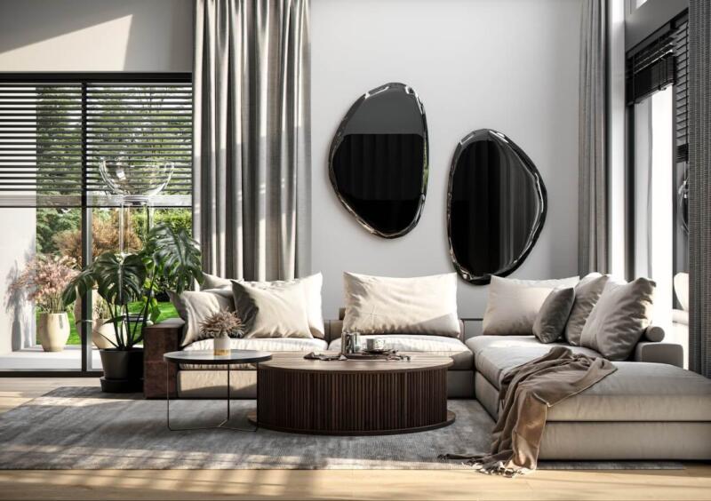Nowoczesny salon z eleganckimi lustrami i komfortową sofą.