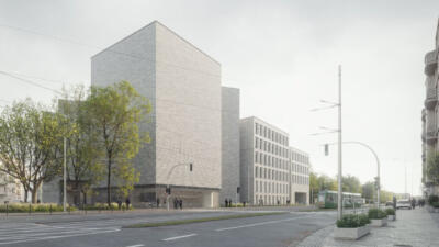 Nowoczesna architektura, jasny budynek z zielenią wokół. Elegancja miasta.