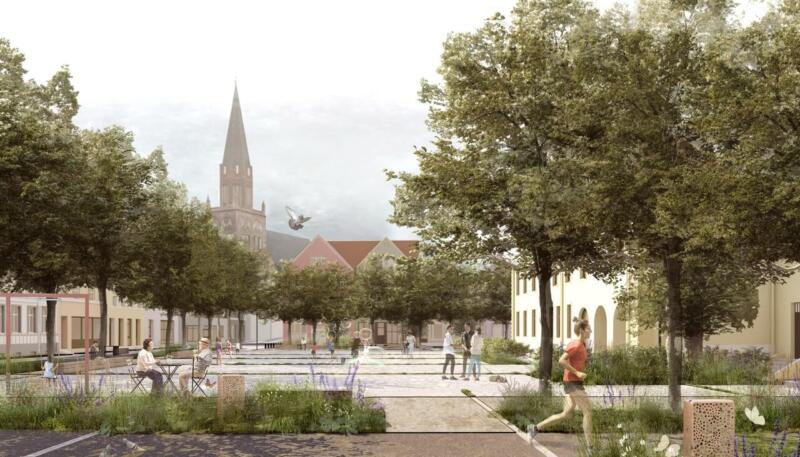 Plac miejski z zielenią i architekturą, sprzyja relaksowi i spacerom.