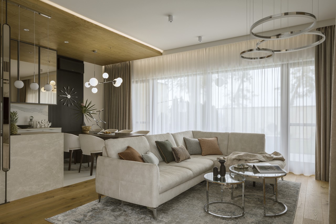 Nowoczesny salon z elegancką sofą i designerskim oświetleniem.