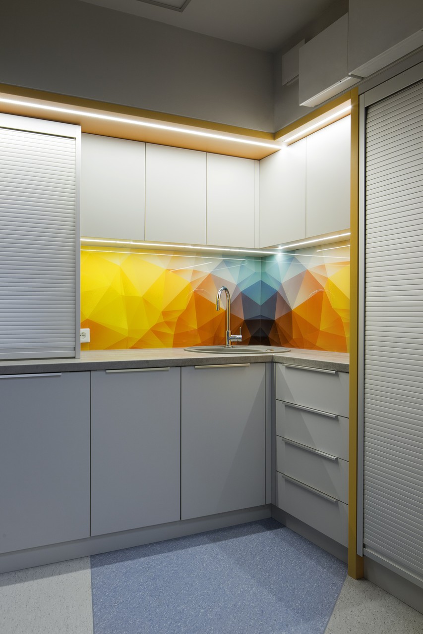 Kitchen with modern geometric color panel.