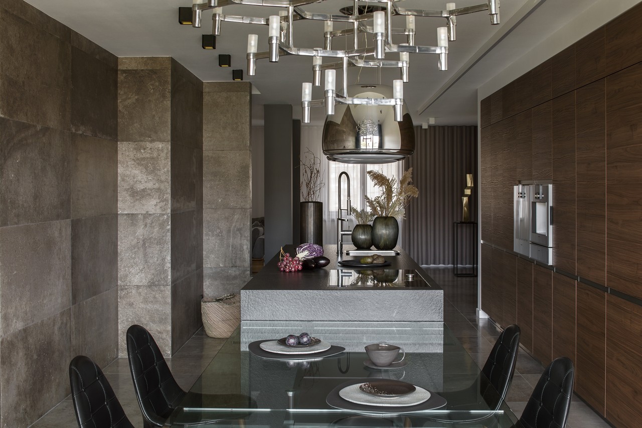Elegant dining room with modern lighting and wooden finish.