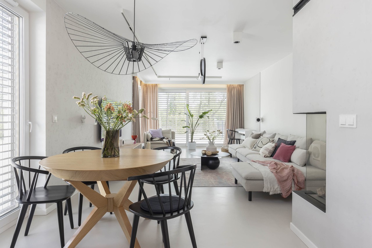 Spacious living room with bright décor and designer lighting.