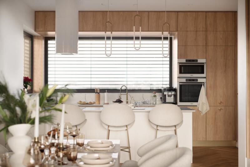 A modern kitchen with wooden cabinets and an elegant countertop.