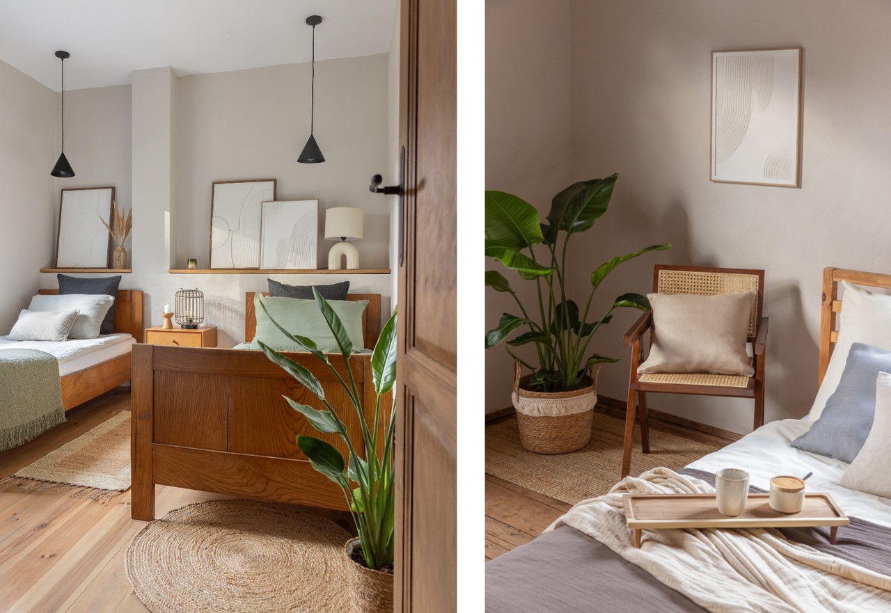 A cosy bedroom with wooden furniture and plants in pots.