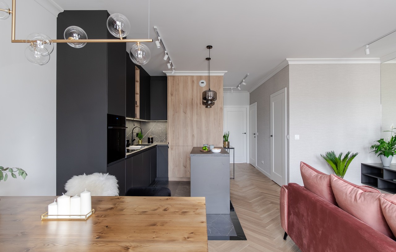 Modern kitchen with island and wooden table. Elegant design.