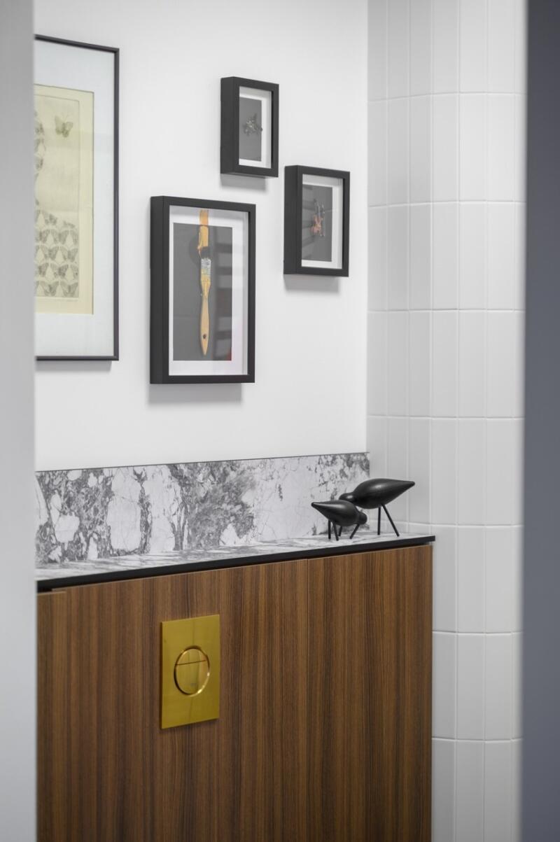 Elegant decor with marble and wall art.