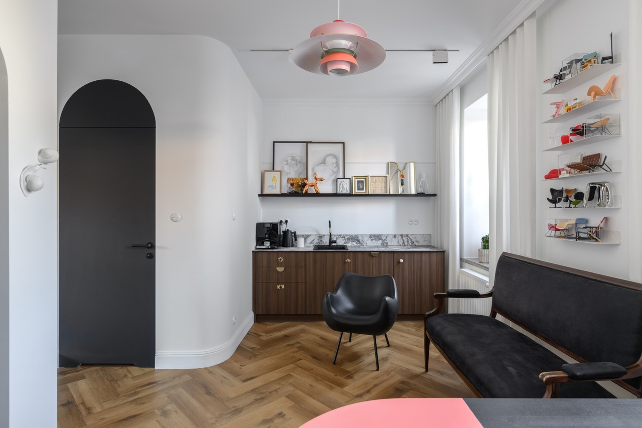 Stylish kitchen with modern lighting and designer seating.