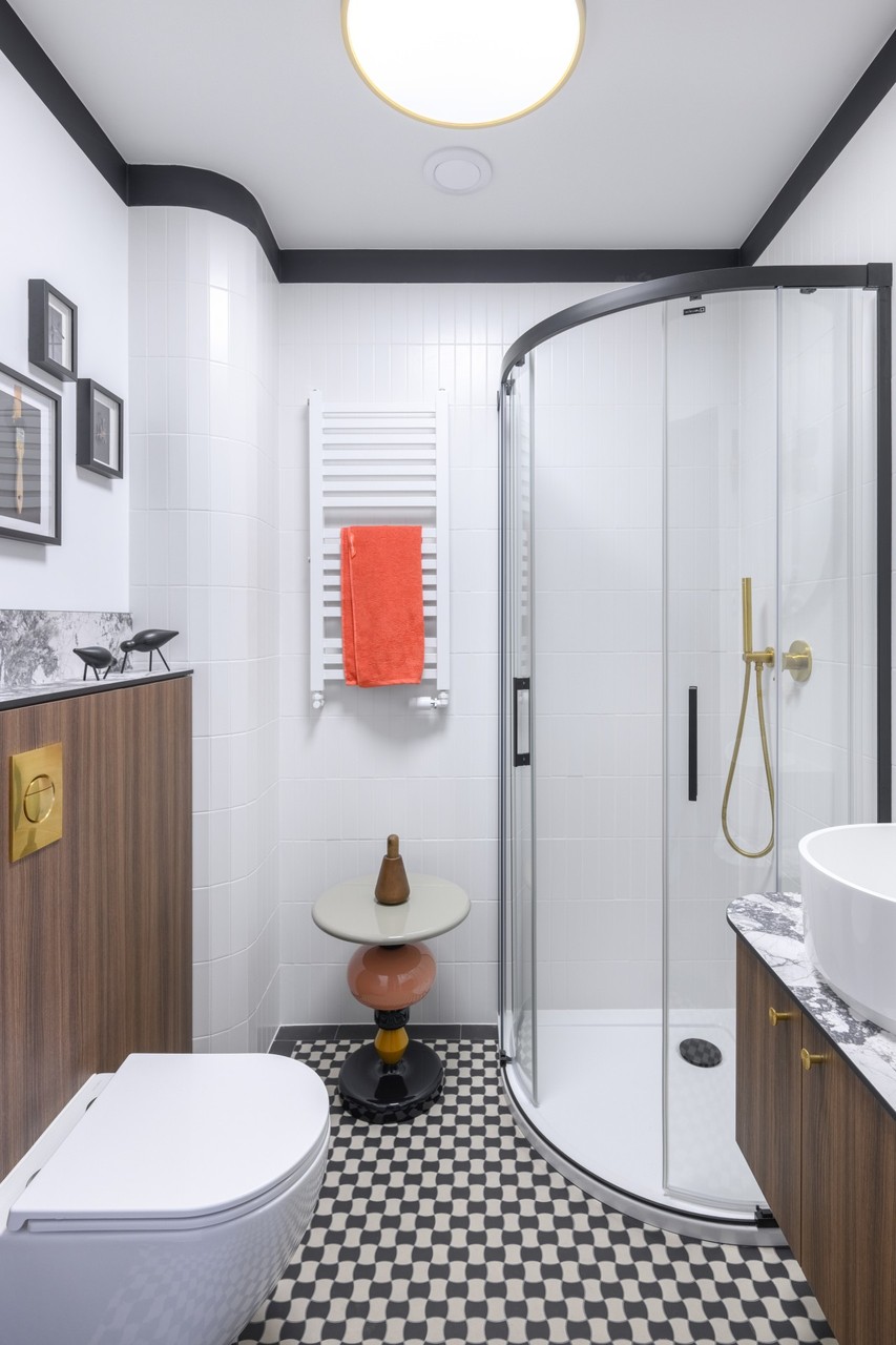 Modern bathroom with shower cubicle and designer accessories.