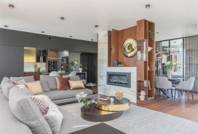 Spacious living room with an elegant fireplace and modern décor.