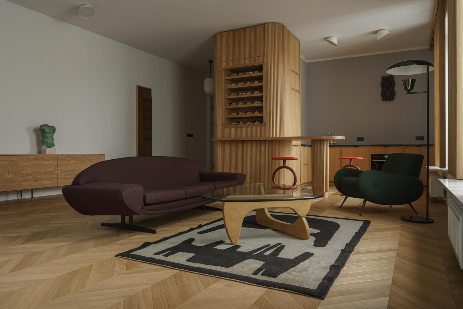 Nowoczesny salon z eleganckimi meblami i stylowym oświetleniem.